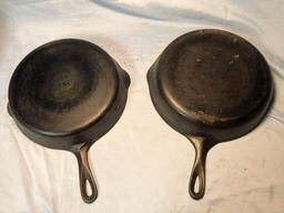 (2) cast iron skillets