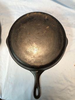 (2) cast iron skillets