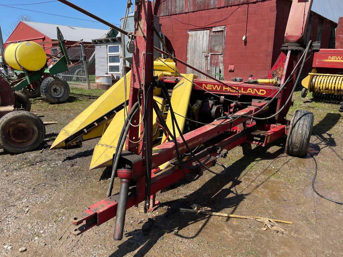 New Holland 770 chopper with two row wide corn head and grass head