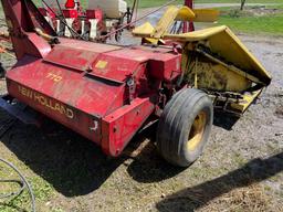 New Holland 770 chopper with two row wide corn head and grass head