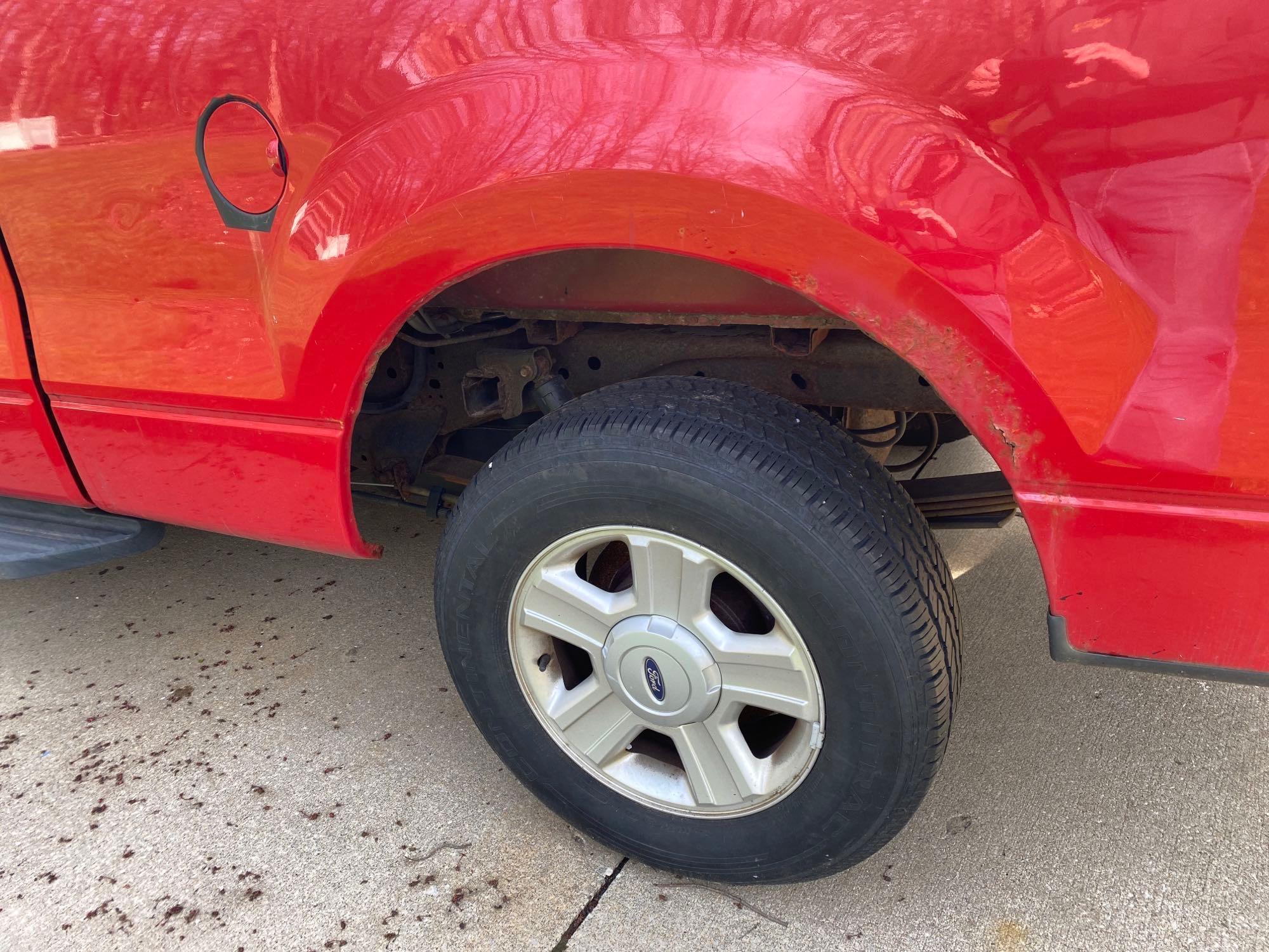 2004 Ford F-150 XLT Triton pickup truck, (125,546 miles), has rust around rear wheel wells.