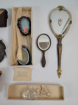 Antique purses, compacts, and dresser accessories