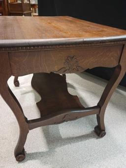 Clean Oak library table with applied carvings, 38inches wide