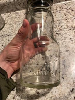 (2) Marquette Auto Oil Jars