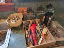 Contents of kitchen cupboards, china set, utensils, canisters, small dog dish, cleaners