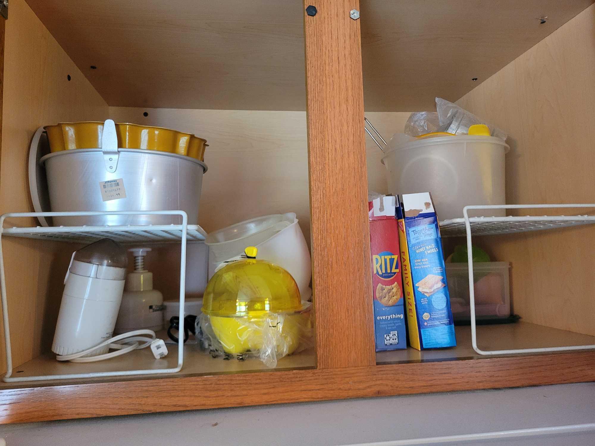 Contents of kitchen cabinets, pots, pans, junk drawers, covered corningware