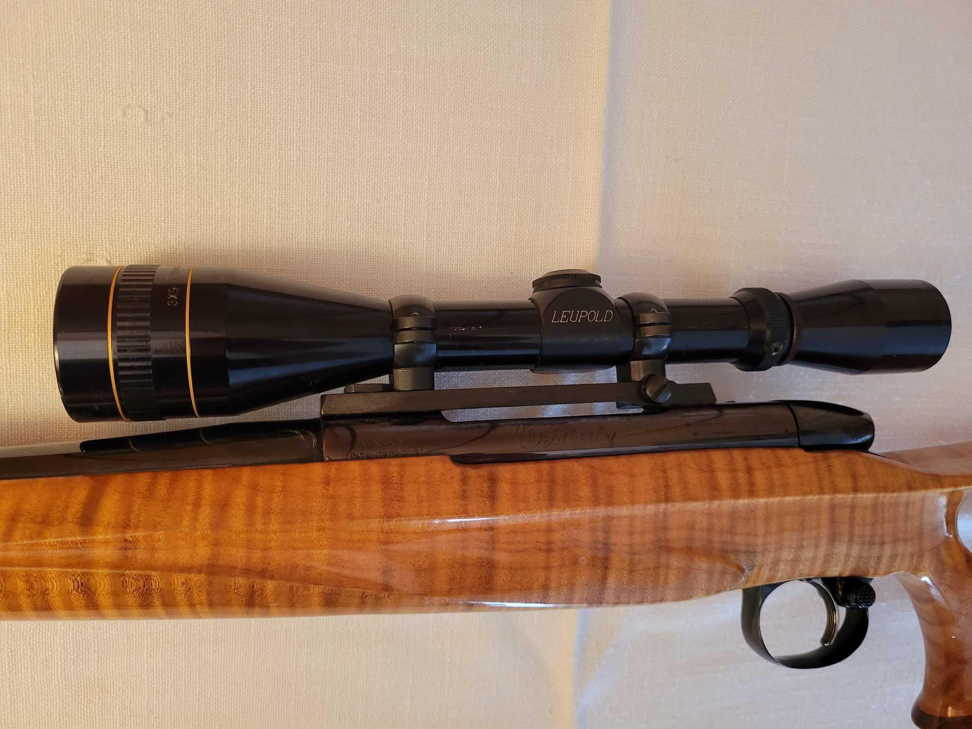 Weatherby mark 270 wby. mag. bolt action rifle with 3-9 leupold scope and hard case