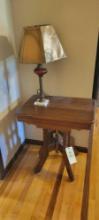 Victorian lamp table with metal base and red glass lamp
