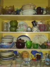 Contents of kitchen cupboard dishes juicers clocks cookie jar