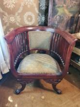 Antique barrel chair with paw feet