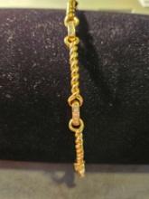 Ladys 18k yellow gold twisted wire link bracelet