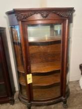 Tall Curio Cabinet With Carved Serpents and claw foot
