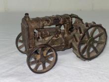 Cast iron tractor, no rider, 6" long x 3" tall.