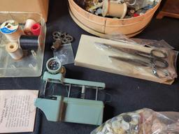 Group of vintage sewing items, pin cushion, buttons, stitcher