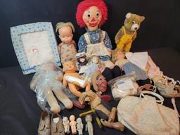 Assorted vintage baby dolls, puppets, kewpie dolls, clothing