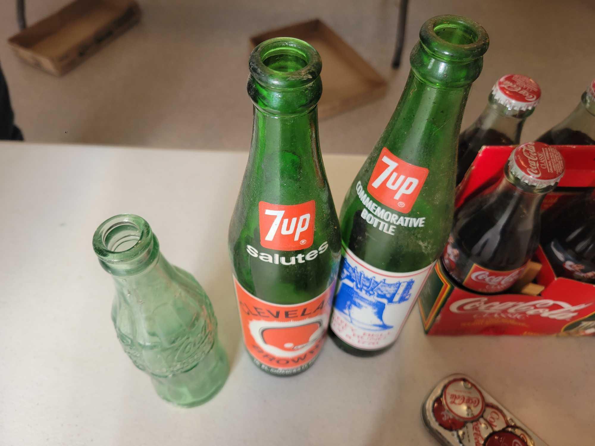 Collectible Coca Cola bottles, 7Up, Coke lamp and decor