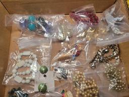 Group of assorted costume jewelry, pins, necklaces, brooches and earrings