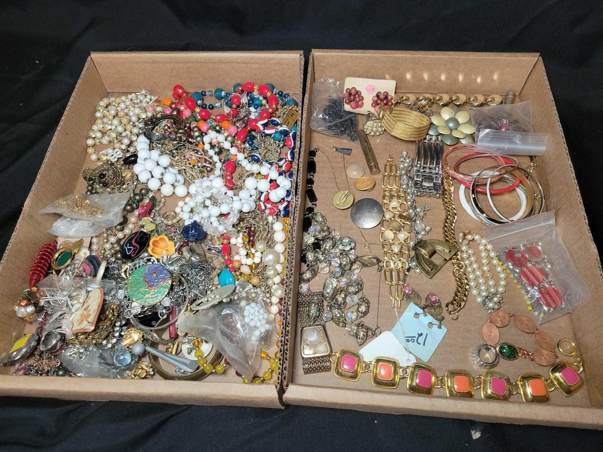 Group of assorted costume jewelry, pins, necklaces, brooches and earrings