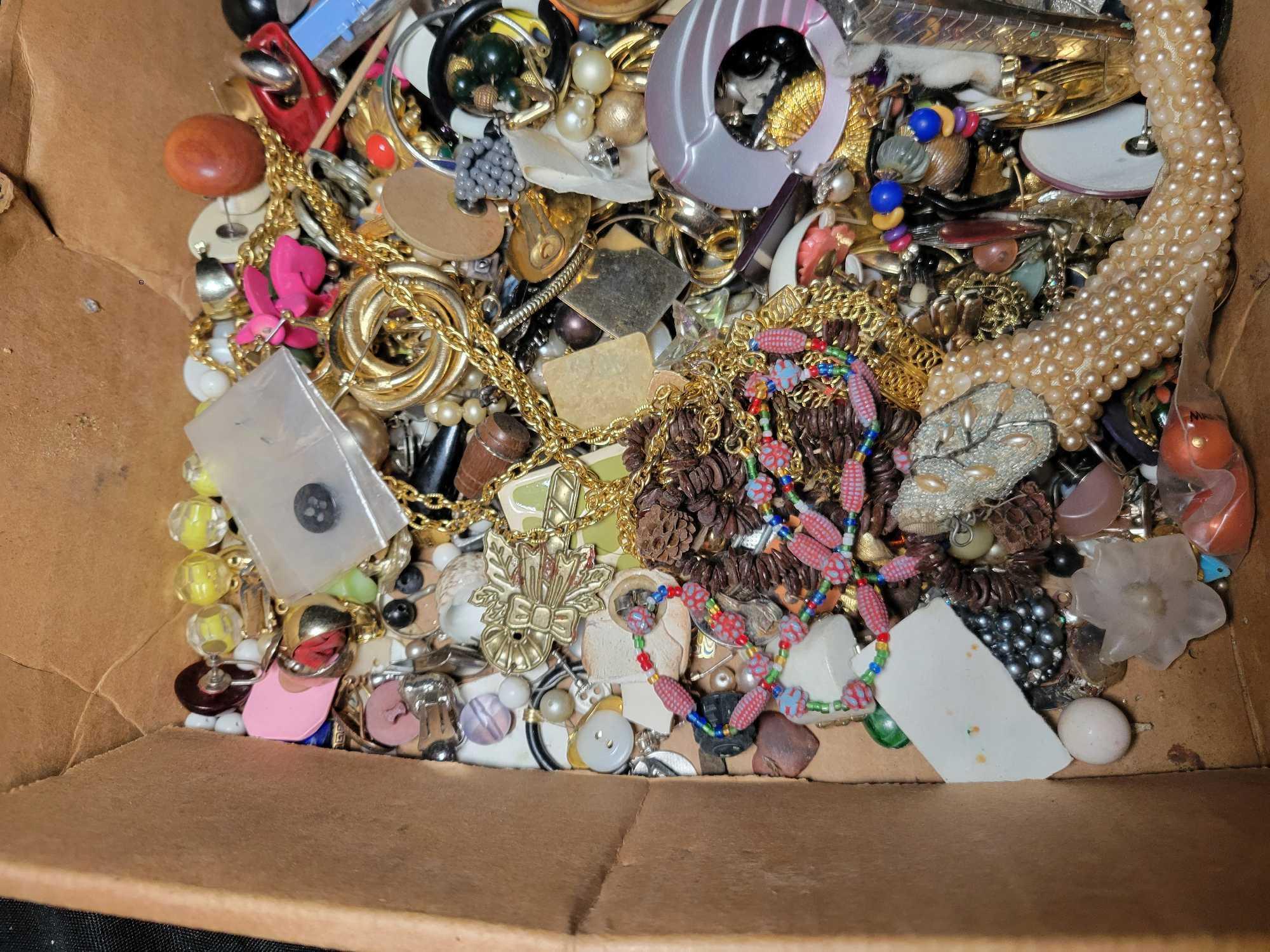 Group of assorted costume jewelry, pins, necklaces, brooches and earrings