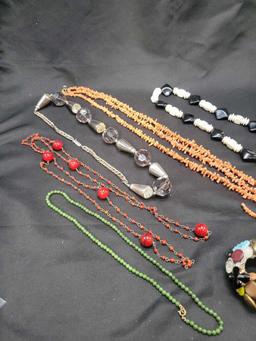 Lot of costume jewelry necklaces and button bracelet