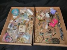 Group of assorted costume jewelry, pins, necklaces, brooches and earrings