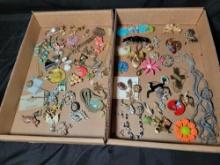 Group of assorted costume jewelry, pins, necklaces, brooches and earrings