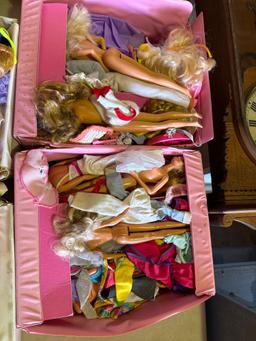 two boxes of assorted Barbie dolls