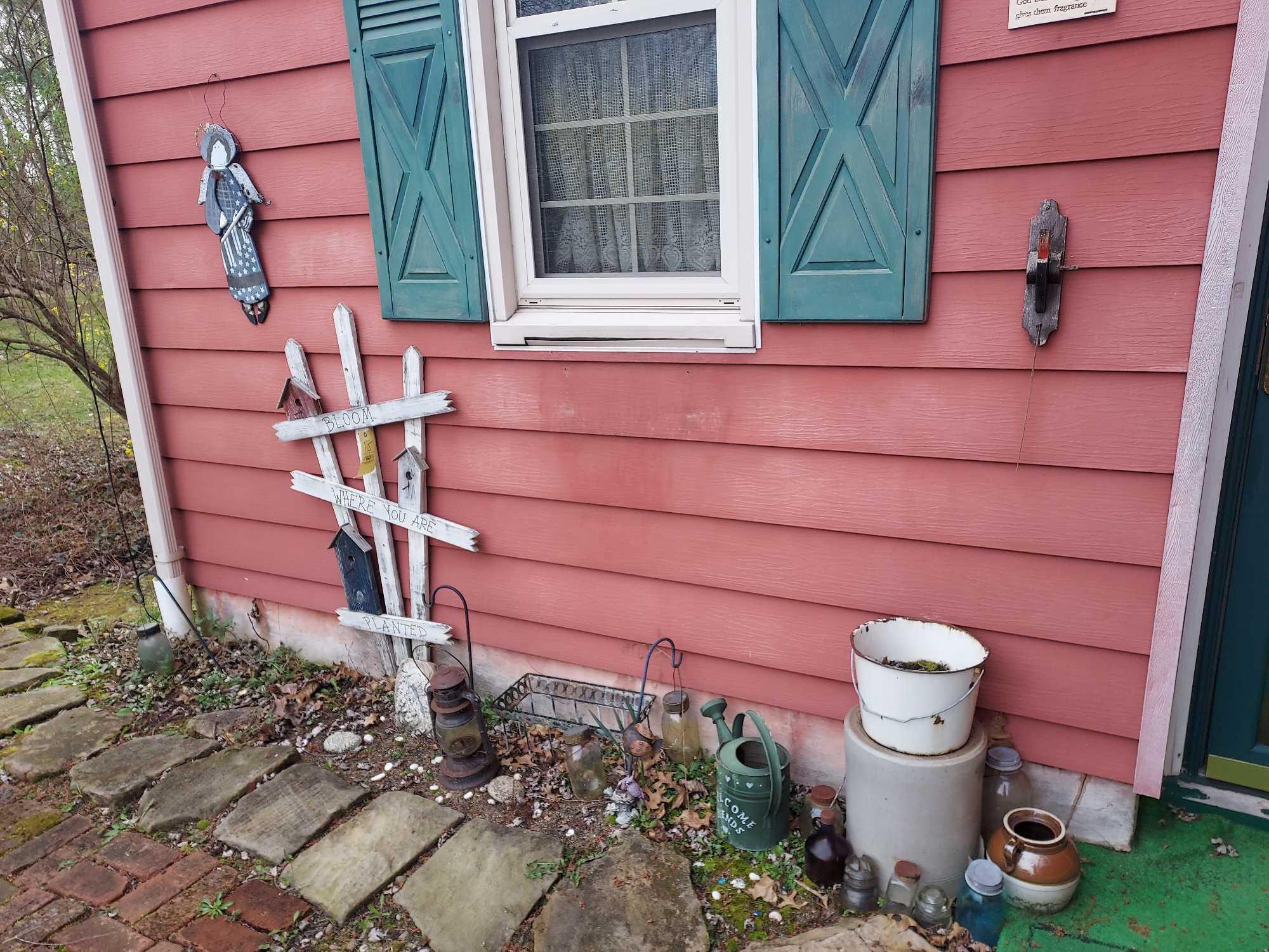 Contents Outside House Side Door - Glass Bottles, Lantern, & Outdoor Decor