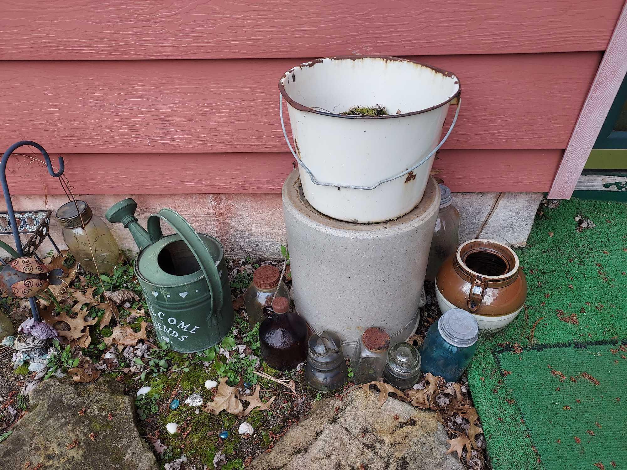 Contents Outside House Side Door - Glass Bottles, Lantern, & Outdoor Decor