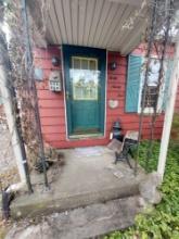 Contents Outside House Front Door - Vintage Students Desk, Milk Can, Damaged Cement Goose, & more