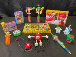 M&M holiday nicknacks, radio, pen, calculator, musical magic CD