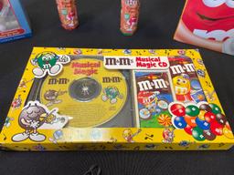 M&M holiday nicknacks, radio, pen, calculator, musical magic CD