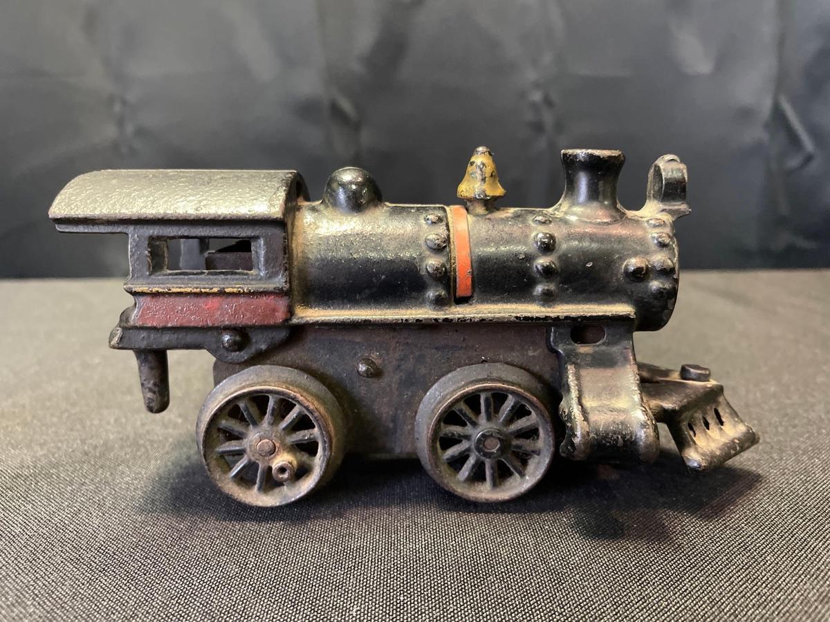 Cast iron toy locomotive, spring power not working, 6" long x 3" tall