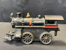 Cast iron toy locomotive, spring power not working, 6" long x 3" tall