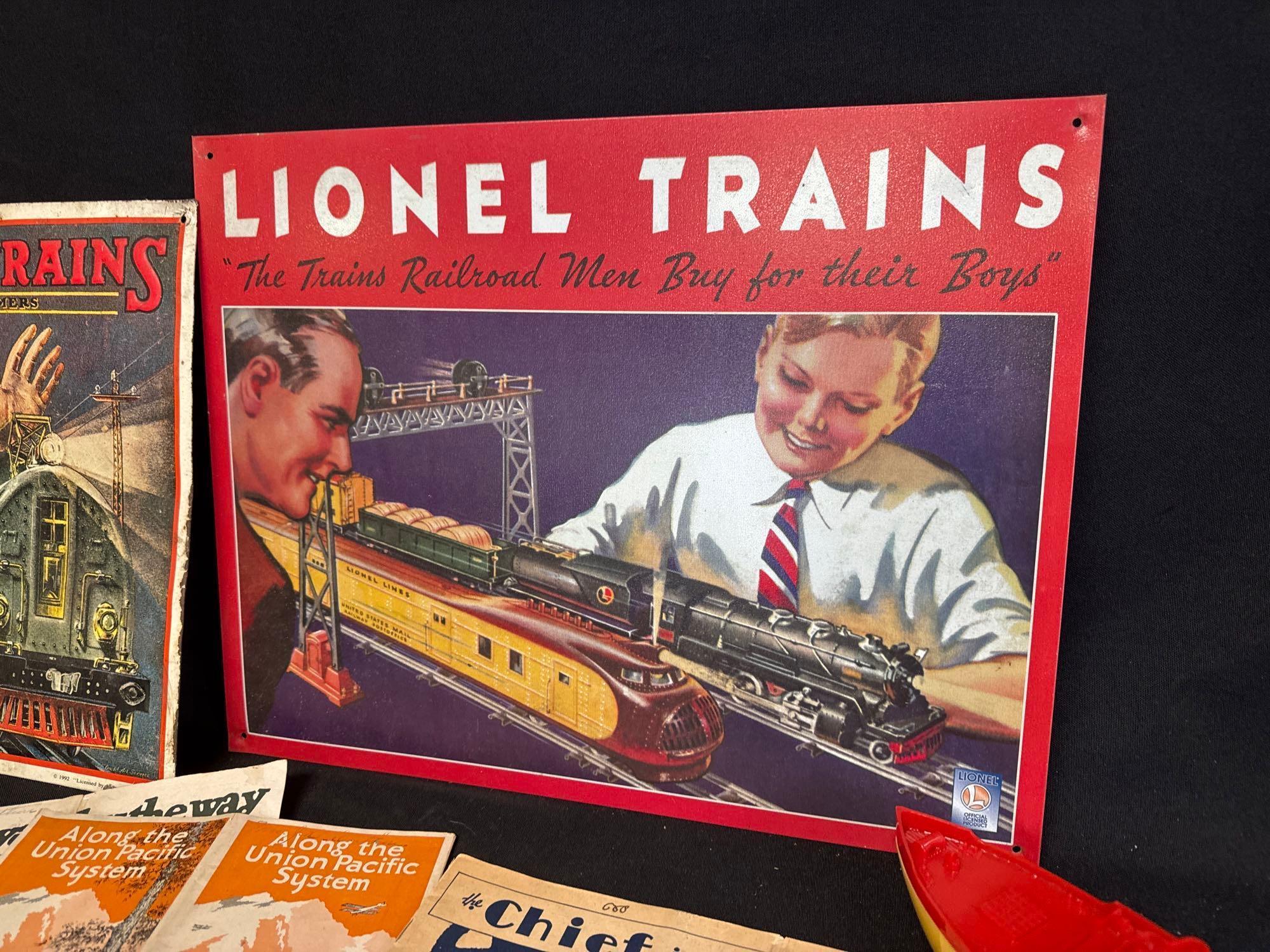 Lionel tin signs, paperwork, snow plow, flat car with horses and more! Great collectors grouping