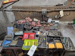 Contents shown on bench, Drill bits, hardware