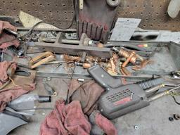 Contents shown on bench, Drill bits, hardware