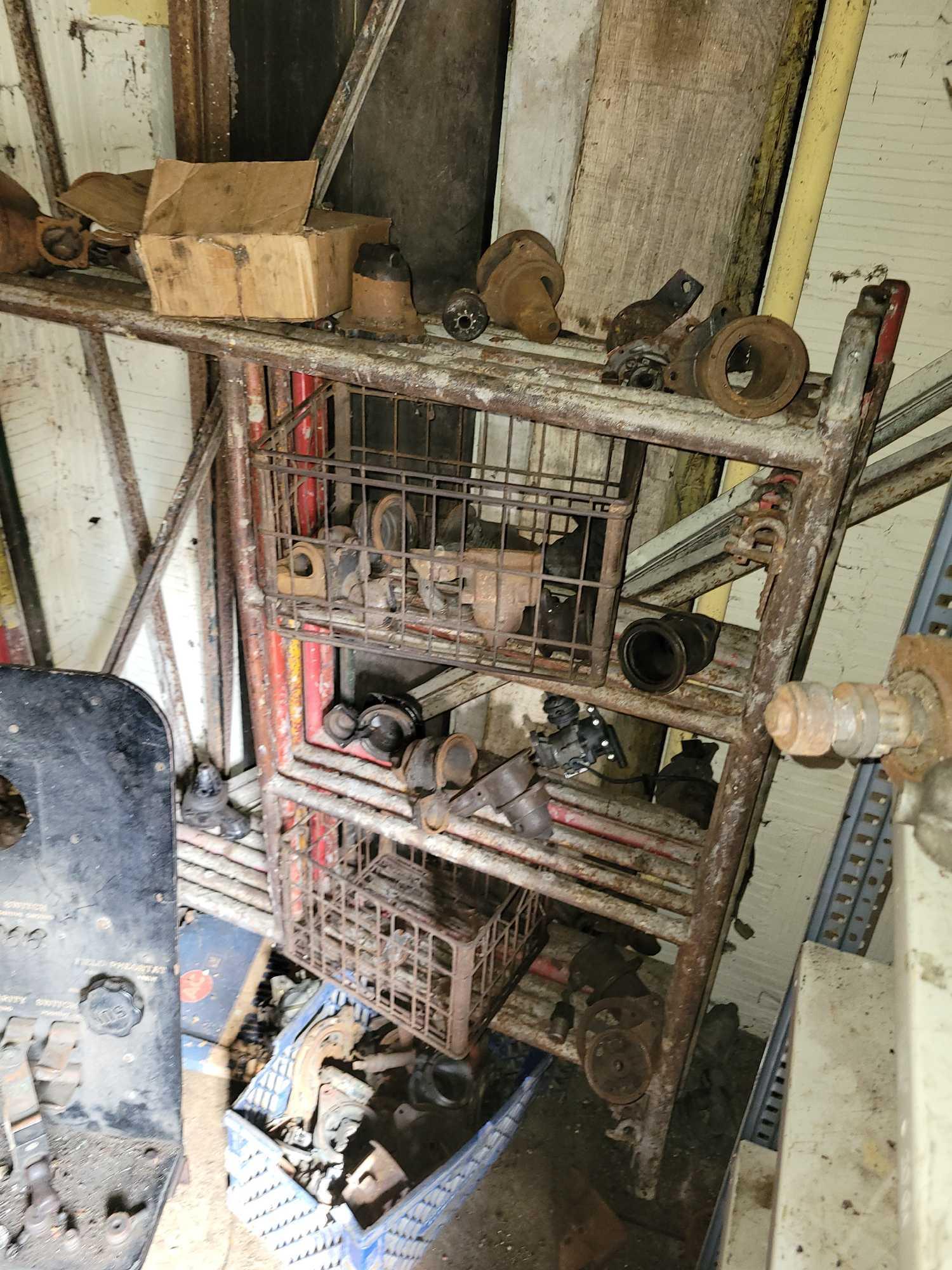 Contents of building, carburetors, engine stand, motor, scaffolding pieces, and more