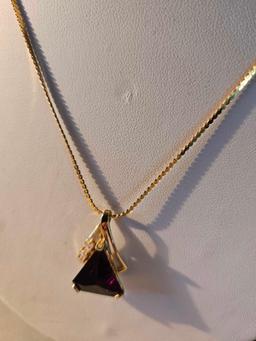 14k gold necklace with synthetic stone pendant