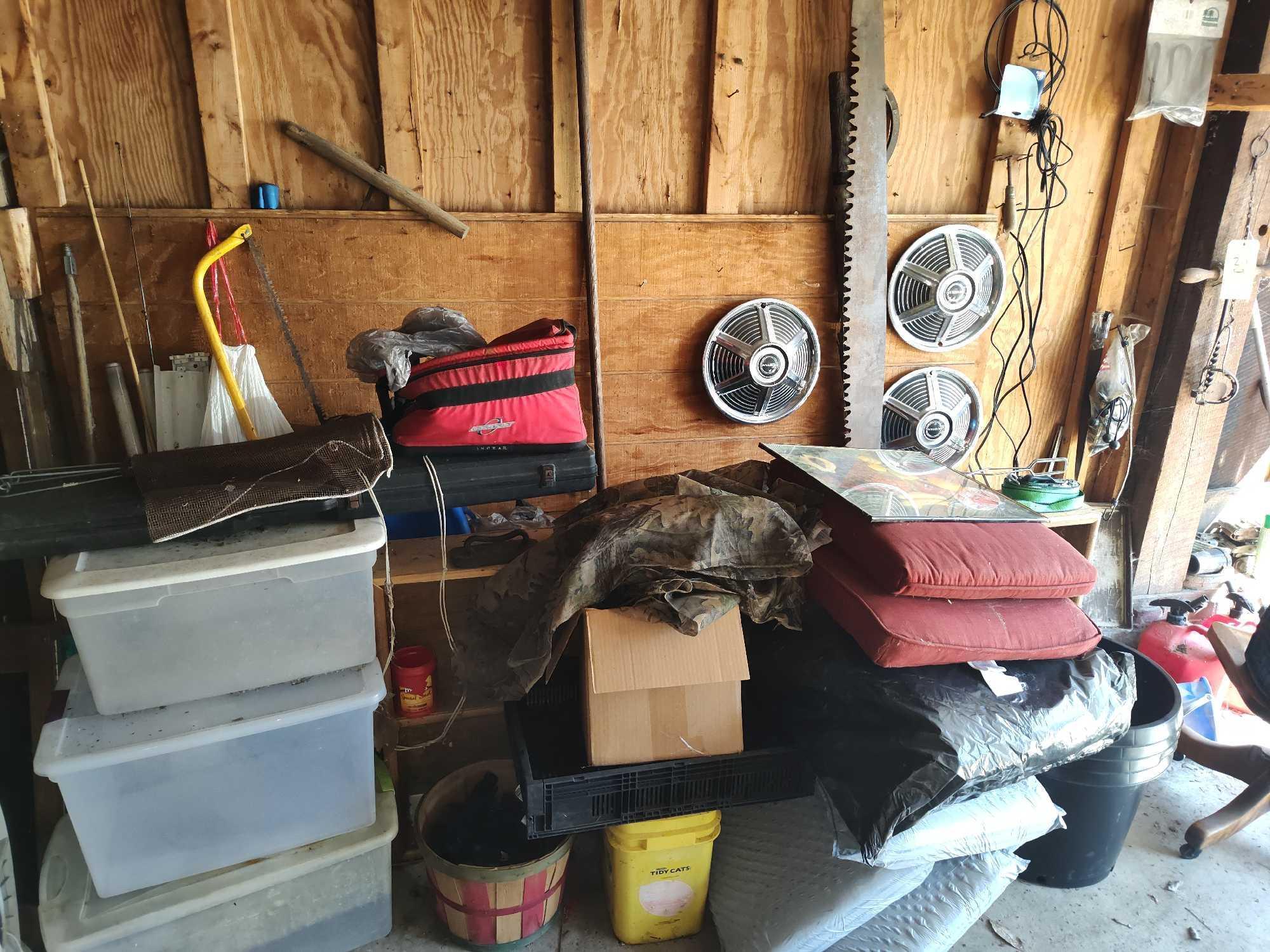 Contents of Wall Garage, Saw, Hubcaps, totes, gas cans