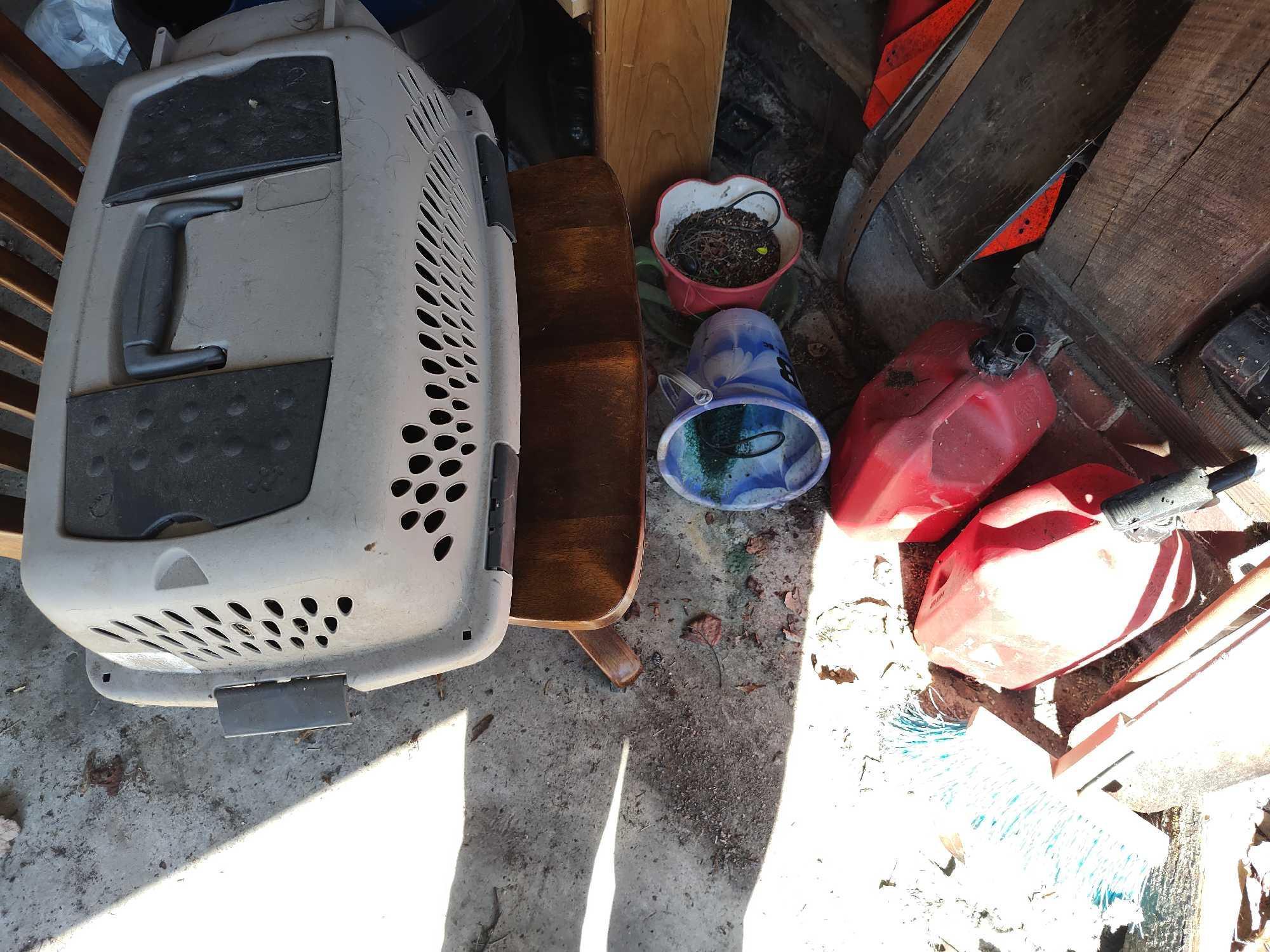 Contents of Wall Garage, Saw, Hubcaps, totes, gas cans