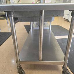 30in x 5ft stainless steel table on casters with pot and utensil holder