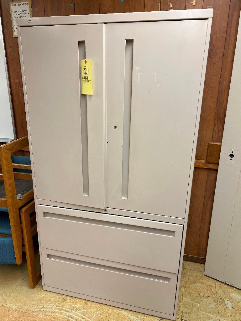 Tan metal storage cabinet with drawers, one door is locked