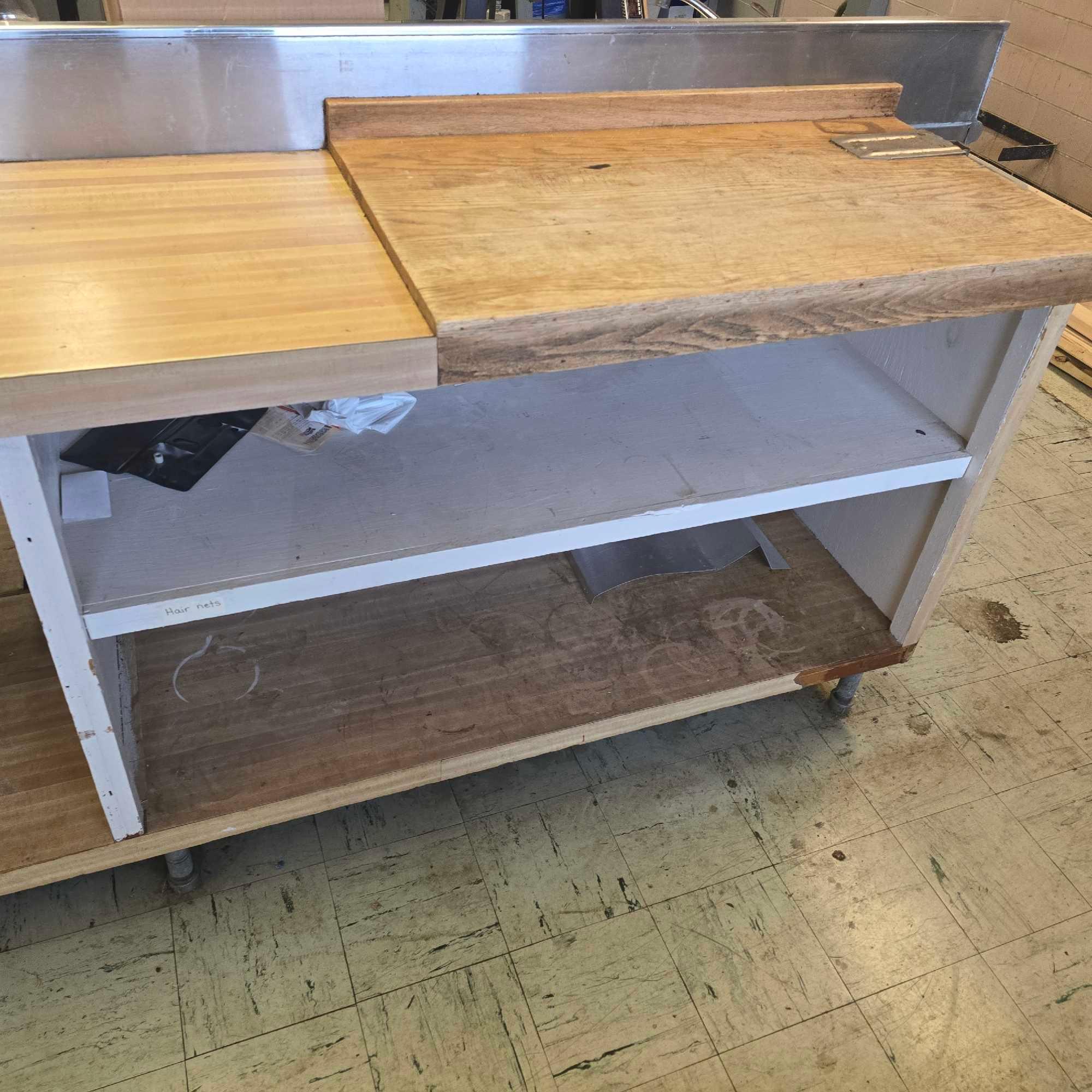 large stainless Steel counter with sink and outlets