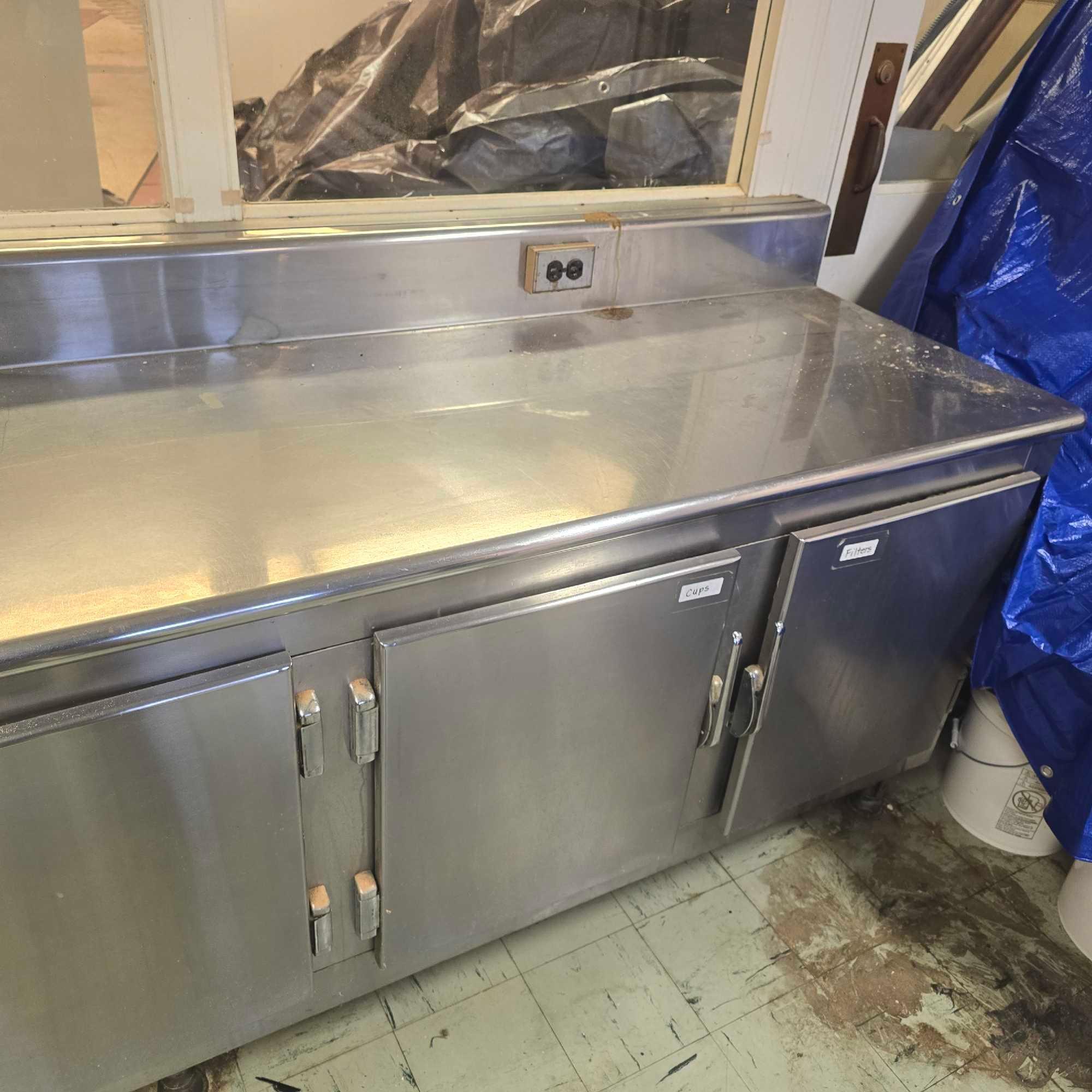 large stainless Steel counter with sink and outlets