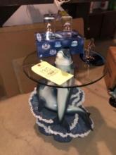 Dolphin glass top table and figures