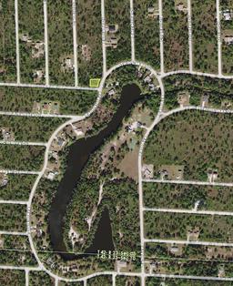 BECOME A FLORIDA SNOWBIRD! Corner Property Just Footsteps Away from Bisset Park and a Lake!