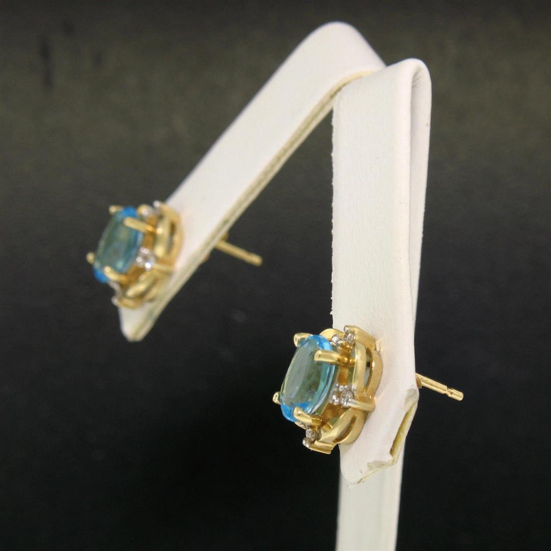 14K Yellow Gold 1.18 ctw Oval Blue Topaz & Round Diamond Halo Stud Earrings