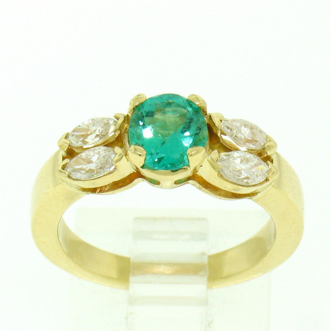 18kt Yellow Gold 1.73 ctw Round Emerald and Marquise Diamond Ring