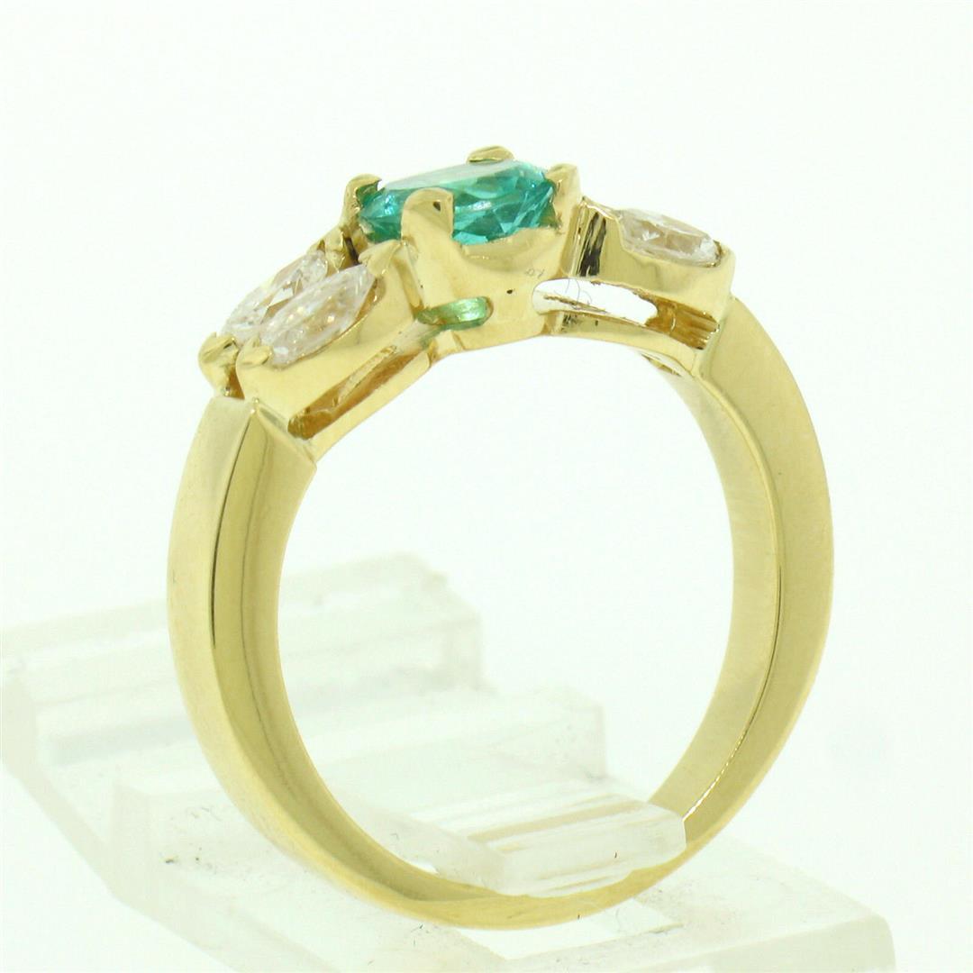 18kt Yellow Gold 1.73 ctw Round Emerald and Marquise Diamond Ring